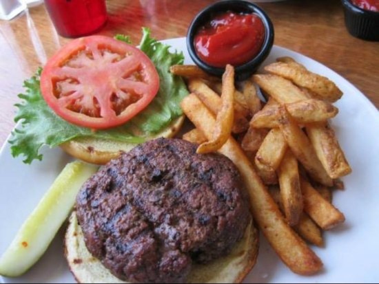 The East Brookfield Burger comes with lettuce and tomato, served with french fries and pickles