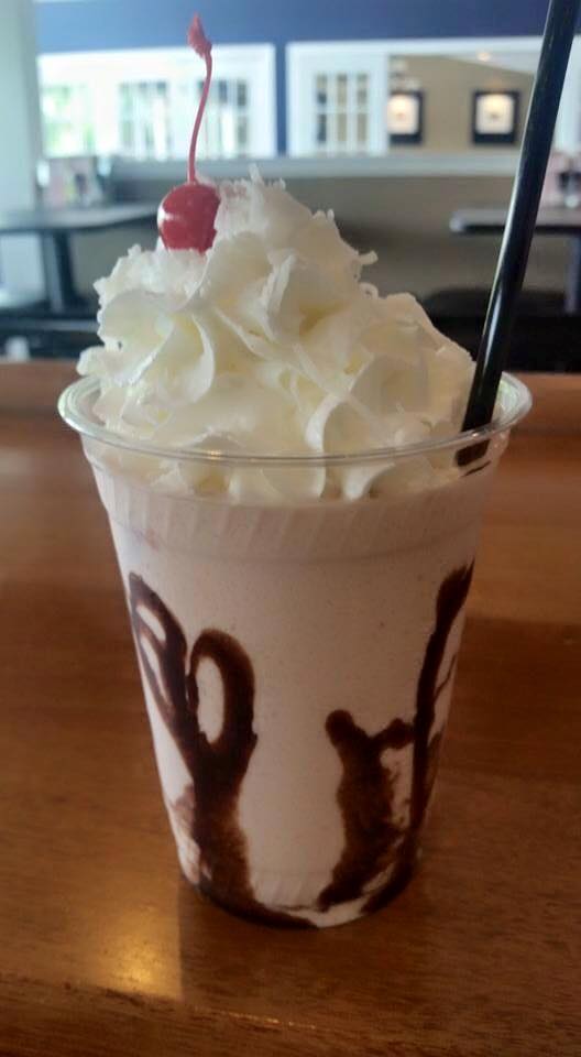 Enjoy a frozen drink with whipped cream and a cherry at 308 Lakeside